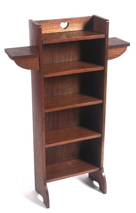 Appraisal: An Arts and Crafts style oak slender bookcase with heart