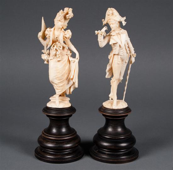 Appraisal: Pair of Continental carved ivory figures of an th century