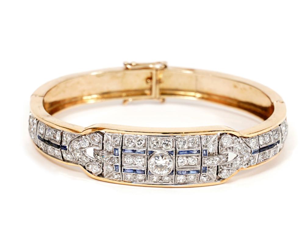 Appraisal: YELLOW GOLD DIAMOND SAPPHIRE HINGED BRACELETArt Deco style diamond sapphire