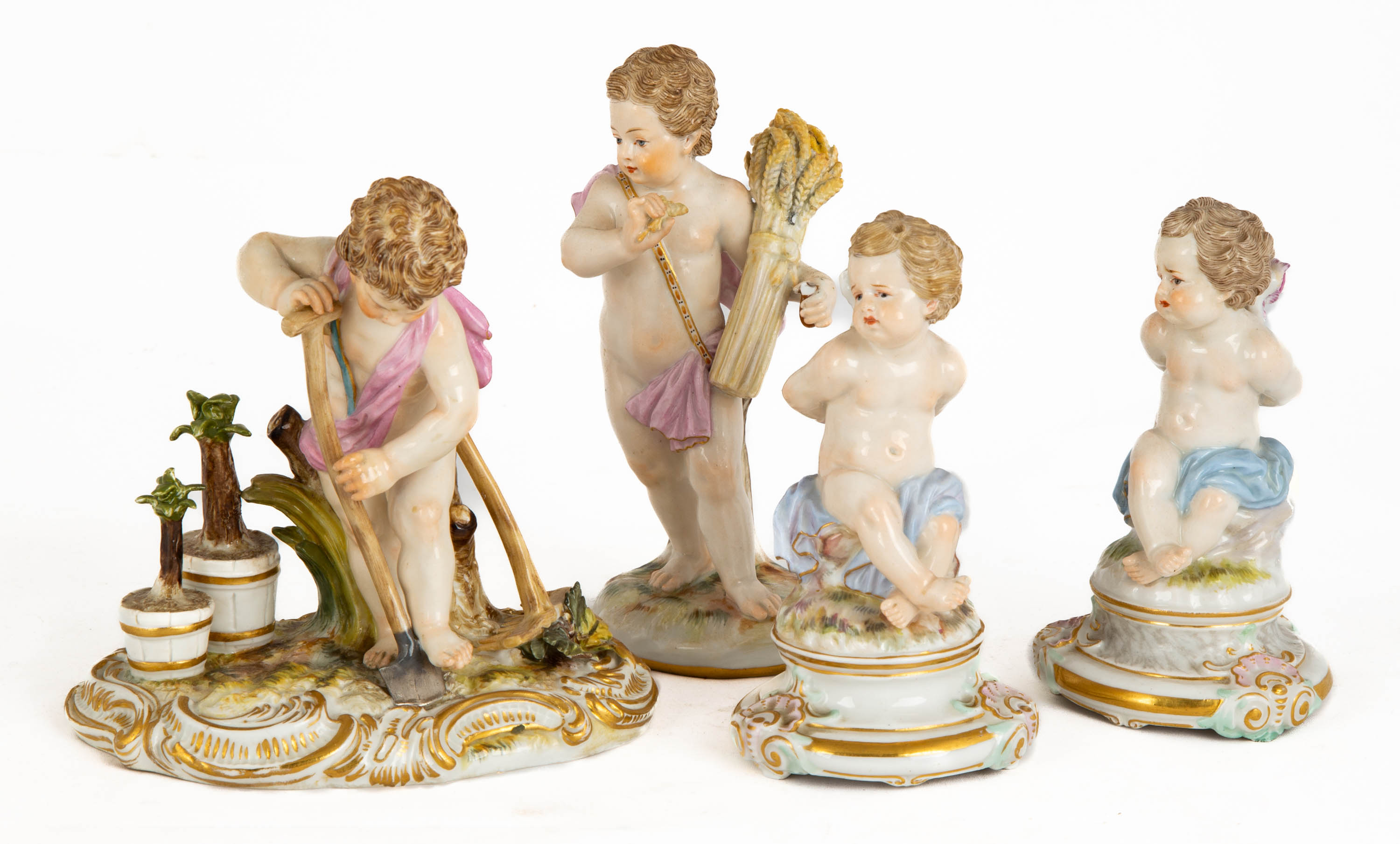 Appraisal: MEISSEN PUTTO GROUPS th century blue crossed swords