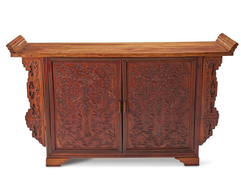 Appraisal: A Chinese carved wood cabinet th Century The cabinet constructed