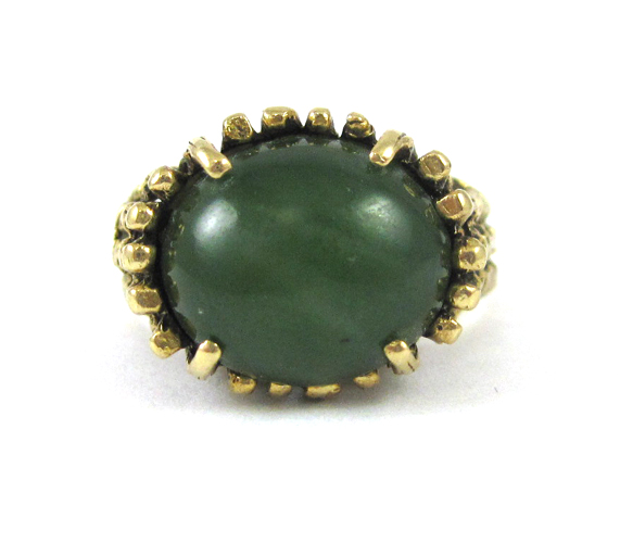 Appraisal: FAUX JADE AND FOURTEEN KARAT GOLD RING set with an