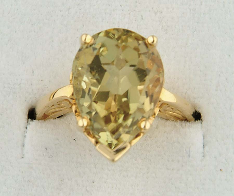 Appraisal: K YELLOW GOLD AND GOLDEN TOURMALINE RING Fancy setting marked