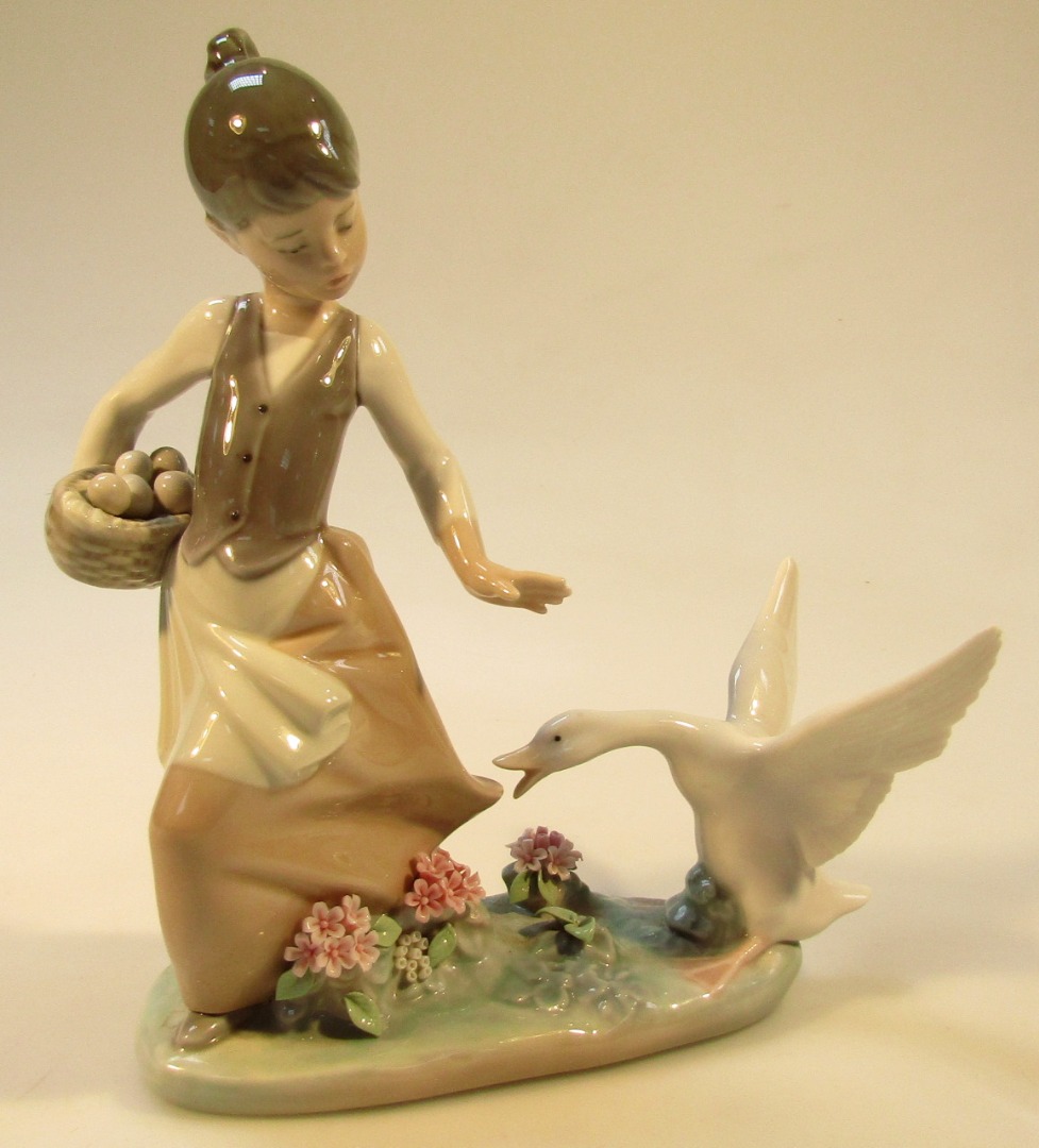 Appraisal: A thC Lladro figure of a girl holding eggs being