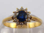 Appraisal: A yellow metal tests carat gold sapphire and diamond ring