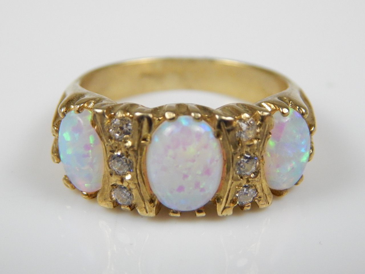 Appraisal: A modern dress ring set with imitation opal and white