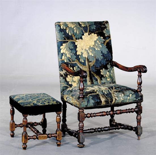 Appraisal: Jacobean style carved walnut armchair and footstool late th centurytapestry