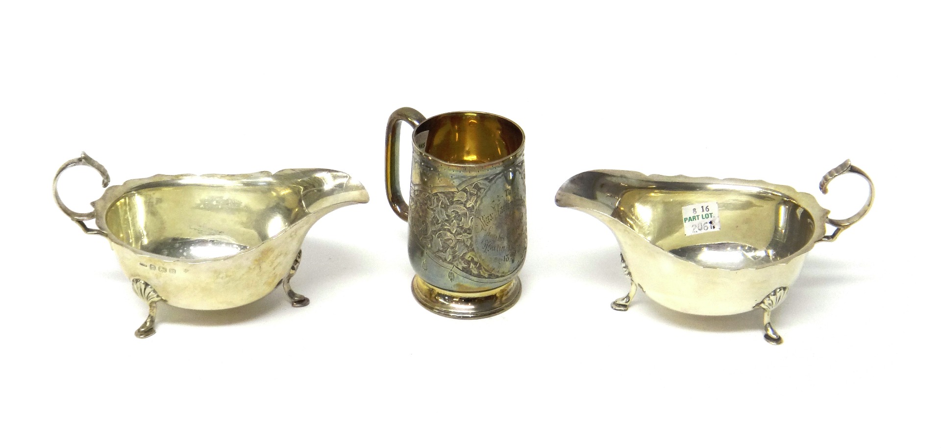 Appraisal: A Victorian silver christening mug Birmingham with engraved scroll decoration