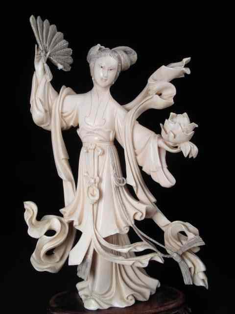 Appraisal: Chinese carved ivory figurine woman with fan Depicts a woman