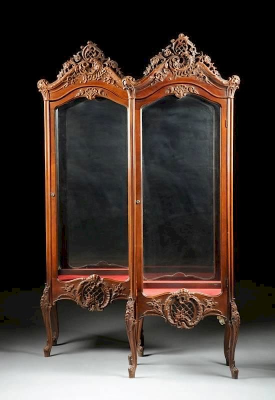 Appraisal: A PAIR OF ROCOCO REVIVAL STYLE CARVED WALNUT VITRINES TH