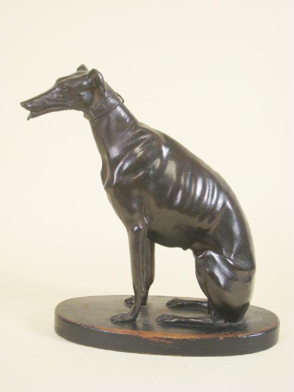 Appraisal: A th Century bronze patinated Model of a seated Greyhound