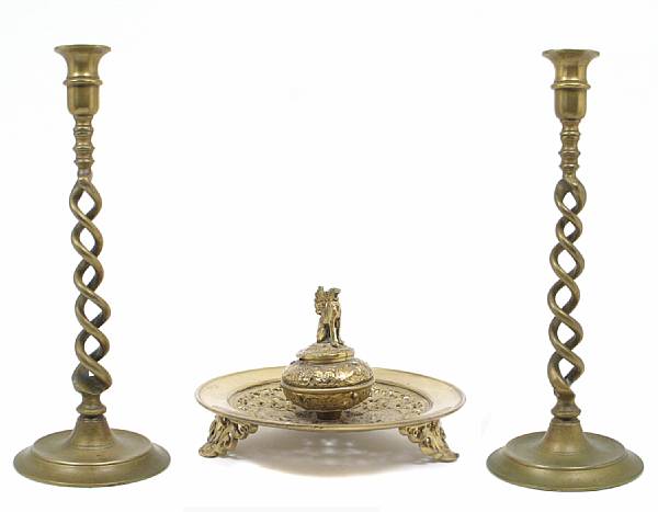 Appraisal: A pair of brass open twist candlesticks together with a