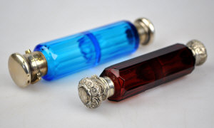 Appraisal: A Victorian ruby glass double ended scent bottle with chased