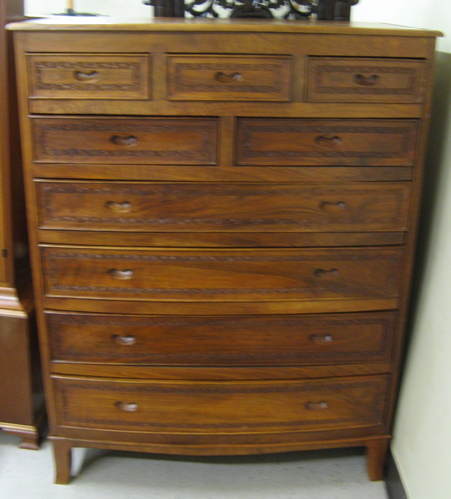 Appraisal: CARVED TEAKWOOD CHEST OF DRAWERS Kashmir India the bow-front chest