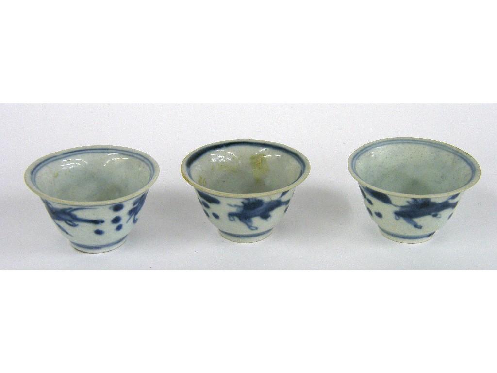 Appraisal: Three Vung Tau Cargo blue and white wine cups painted