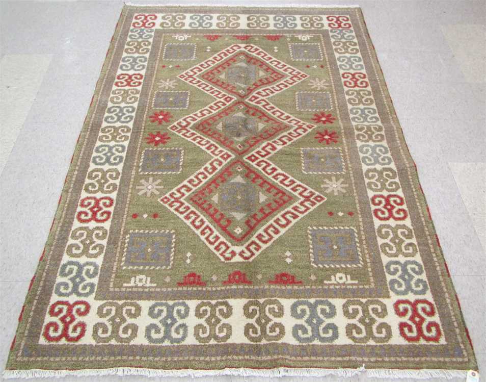 Appraisal: HAND KNOTTED ORIENTAL CARPET Indo-Kazak a three geometric latch-hook medallion