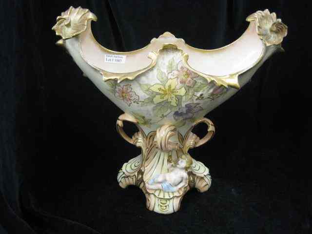 Appraisal: Austrian Porcelain Centerpiecewith child shell horn Art Nouveau style floral