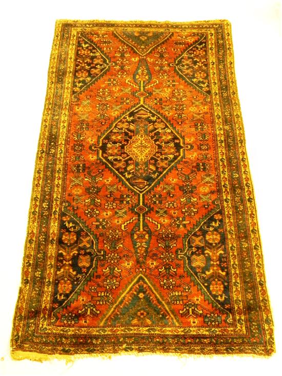 Appraisal: Persian Melayer terracotta field with blue and tan accents ends