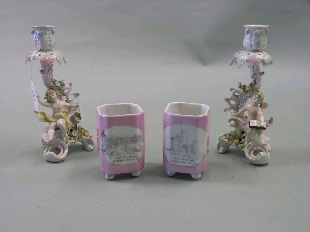 Appraisal: A pair of th century German porcelain figural candlesticks each