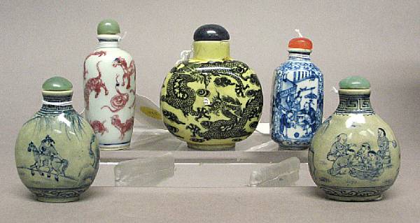 Appraisal: Five porcelain snuff bottles The first painted with black dragons