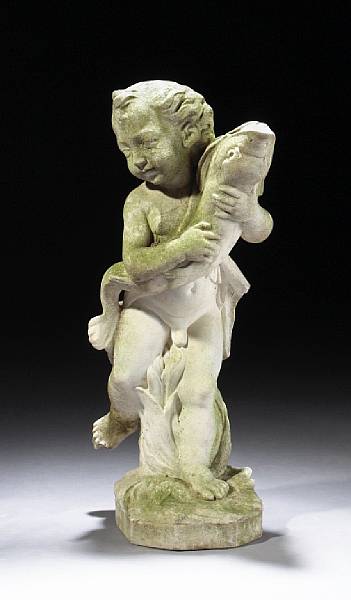 Appraisal: A carved marble fountain head of a putto with dolphin