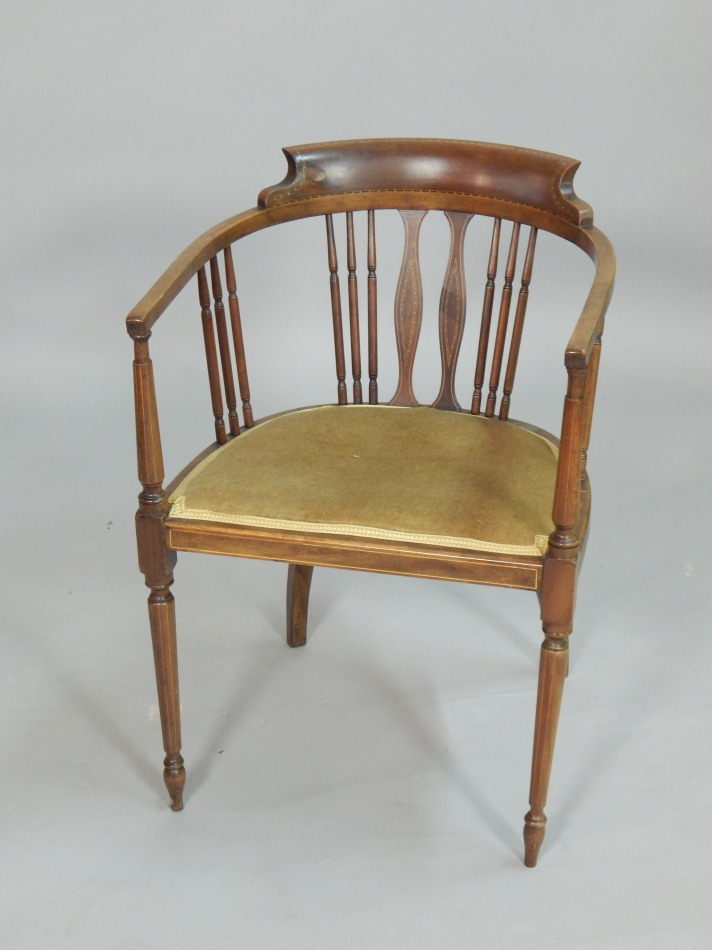 Appraisal: An Edwardian mahogany and chequer banded tub shaped chair with