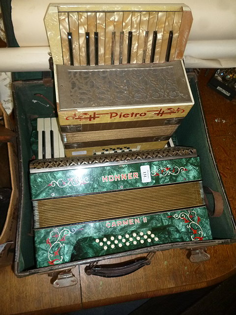 Appraisal: A HONER CARMEN II ACCORDION together with a further smaller