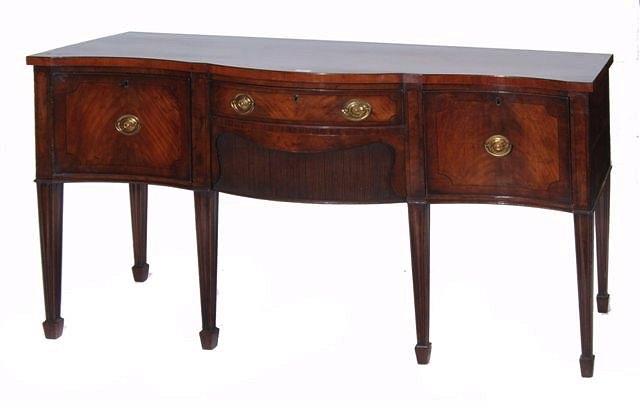 Appraisal: A GEORGE III MAHOGANY SERPENTINE SIDEBOARD having a central drawer