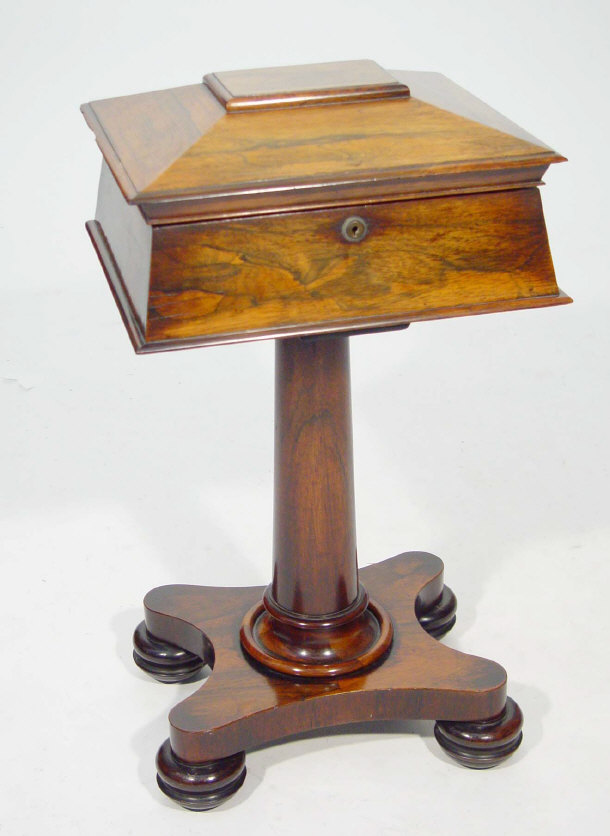 Appraisal: Victorian rosewood teapoy the sarcophagus shaped body with hinged lid