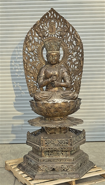 Appraisal: Elaborate Chinese bronze seated Guanyin with flaming mandorla seated on