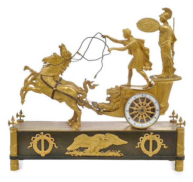 Appraisal: A GILT BRONZE FIGURATIVE MANTEL CLOCK featuring a Roman chariot