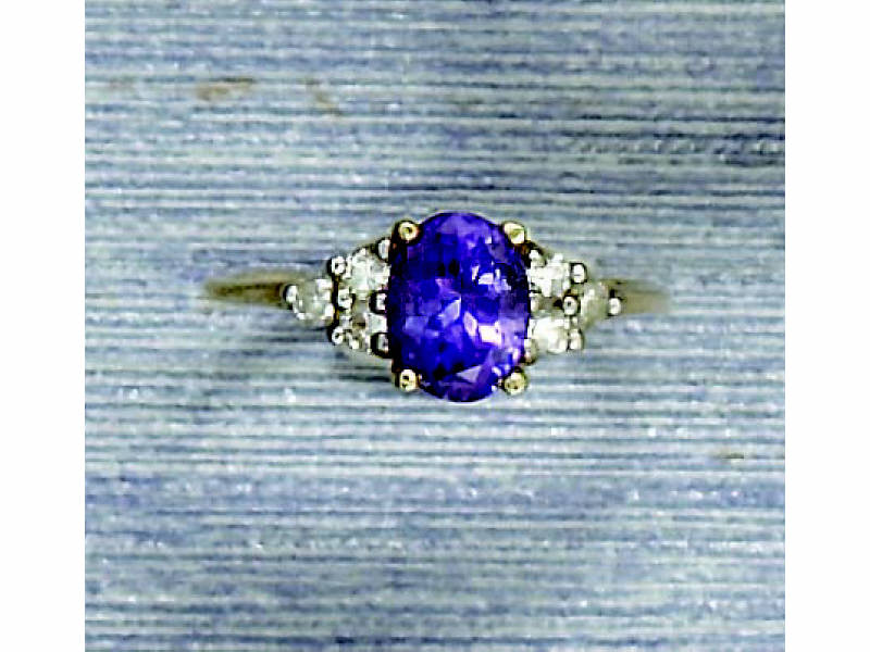 Appraisal: TANZANITE AND DIAMOND RING k yellow gold lady's ring set