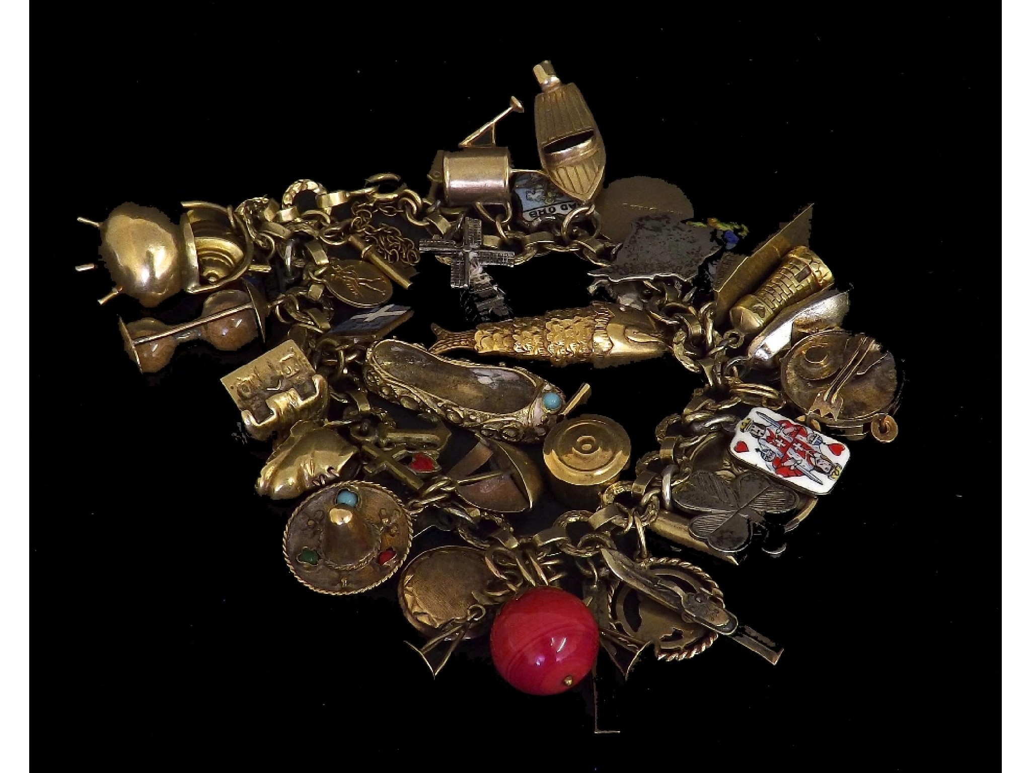 Appraisal: Gold charm bracelet with a large assortment of ct silver