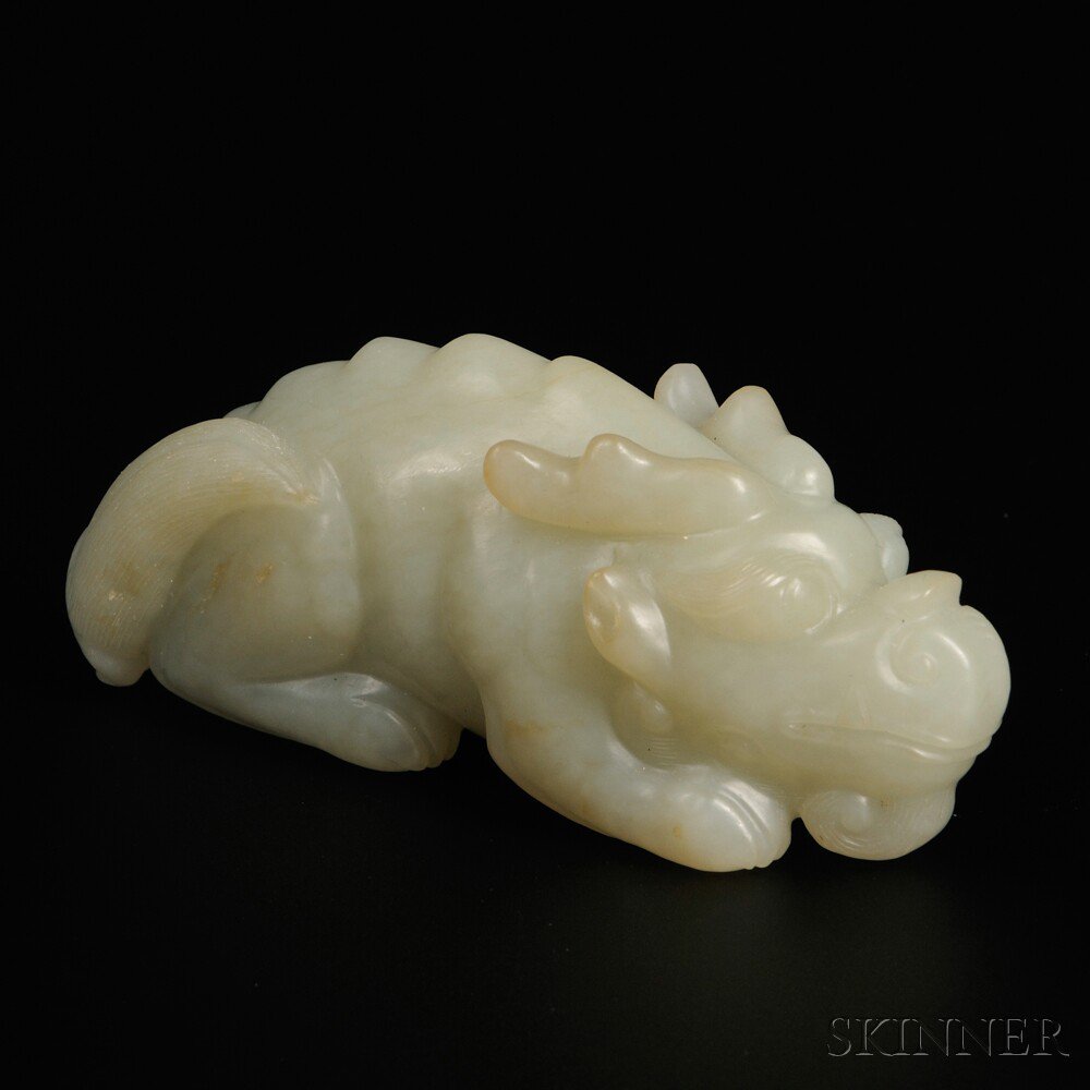 Appraisal: Jade Qilin China the mythical beast carved as crouched stone