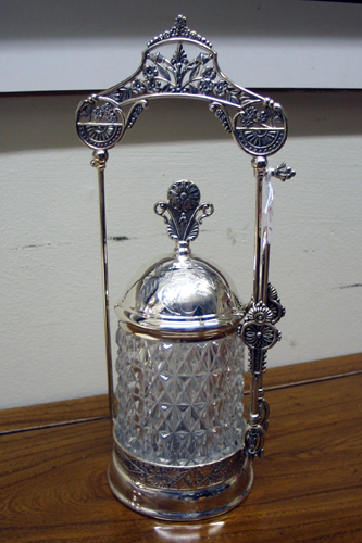 Appraisal: AN ORNATE SILVERPLATED PICKLE CASTER chased and engraved having a