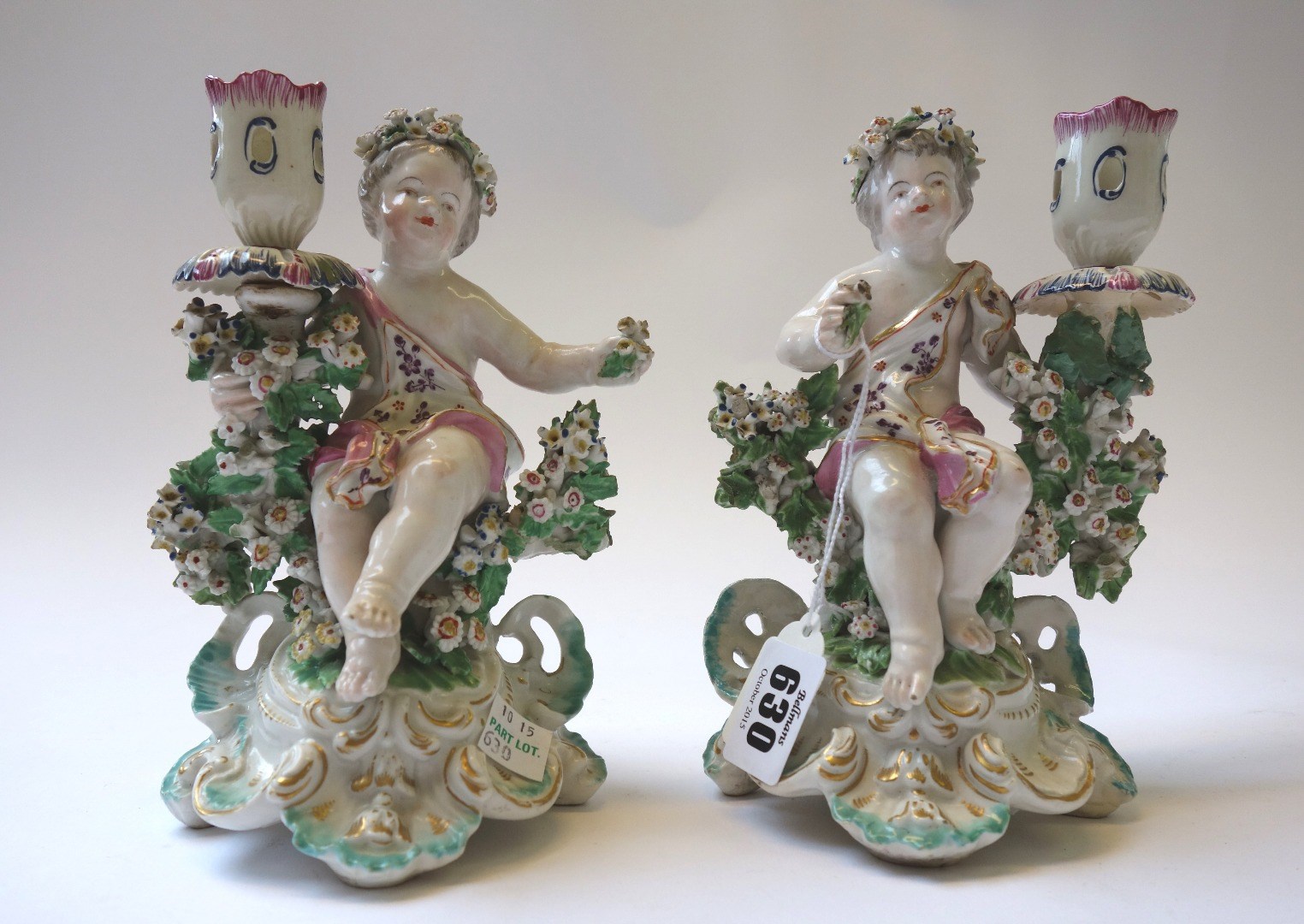 Appraisal: A pair of Derby porcelain figural candlesticks circa each modelled