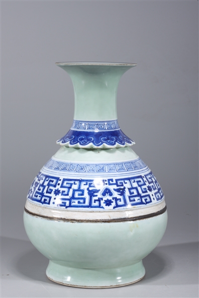 Appraisal: Chinese blue and white celadon glazed vase with molded detail