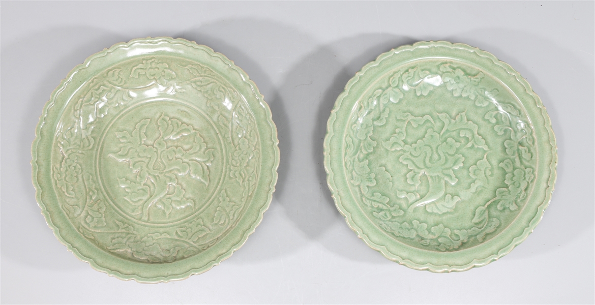 Appraisal: Pair of Chinese celadon glazed ceramic dishes each with molded