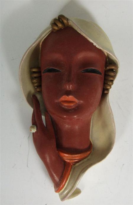 Appraisal: GOLDSCHEIDER WALL MASK S terracotta modelled as the head of