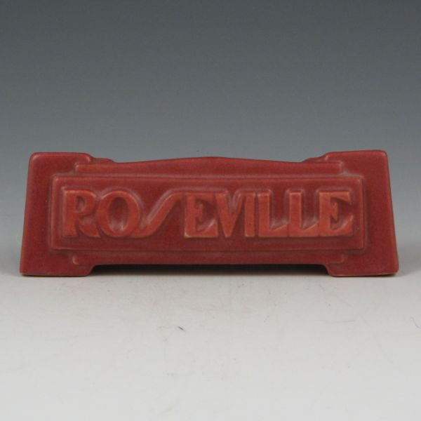 Appraisal: Roseville dealer sign in deco motif finished in mauve or