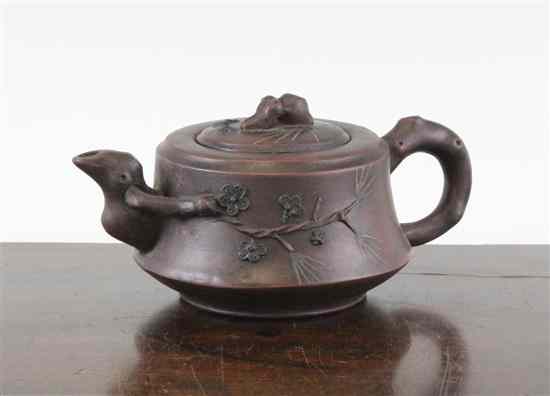 Appraisal: A Chinese Yixing stoneware teapot with pine sprigged decoration ins