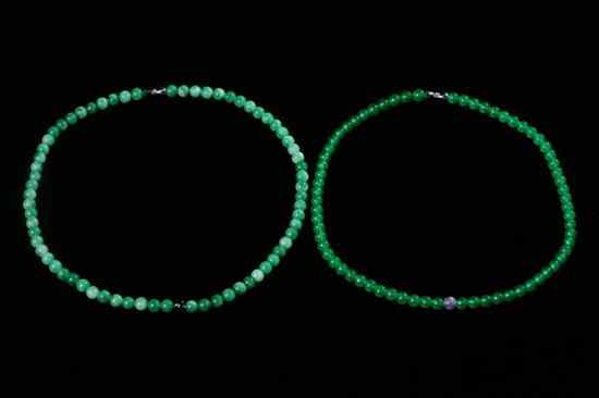 Appraisal: PAIR CHINESE APPLE AND EMERALD GREEN JADEITE NECKLACES - Larger