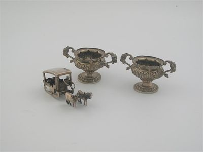 Appraisal: A pair of miniature continental two handled cups and a