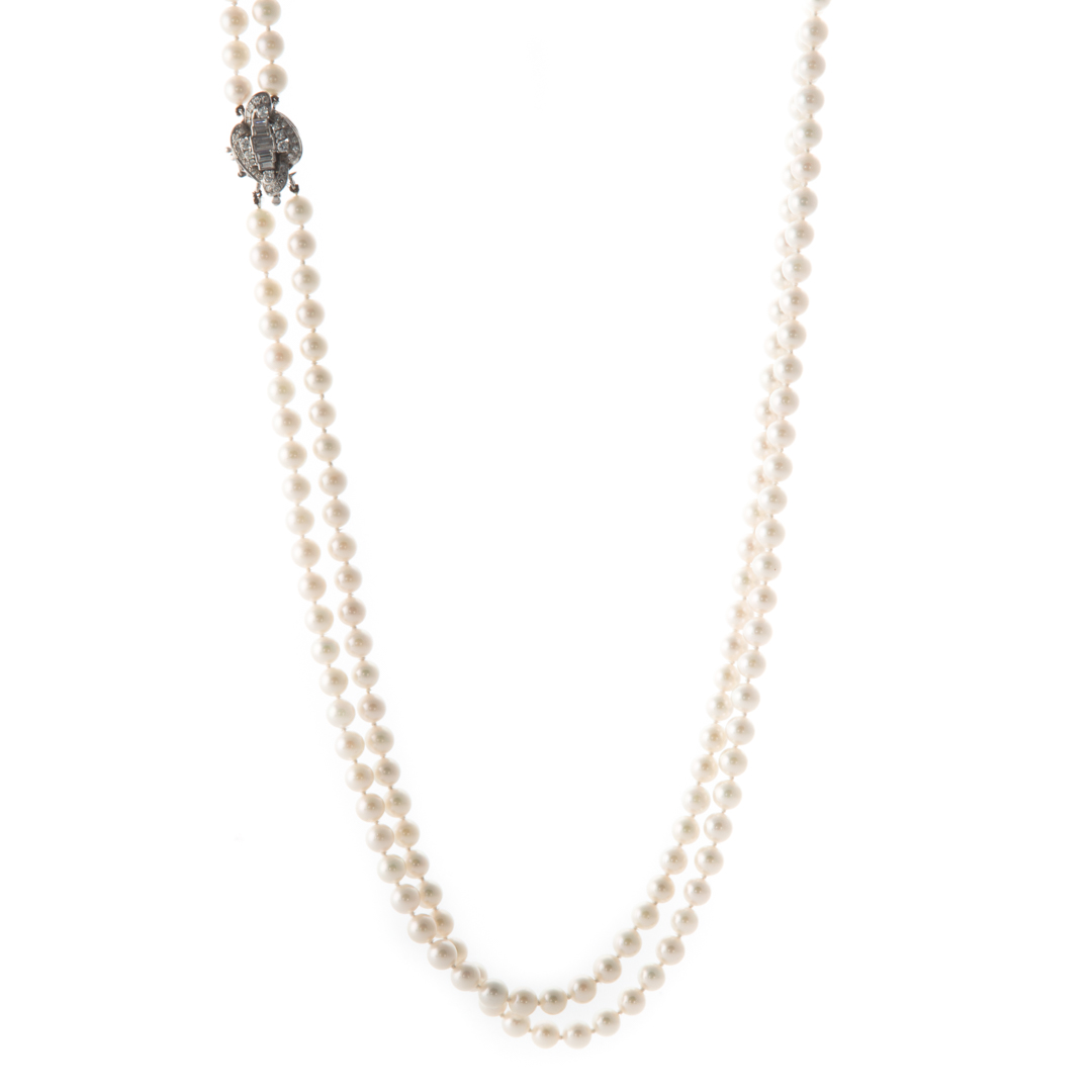 Appraisal: A Double Strand of Pearls with Diamond Clasp Double strand