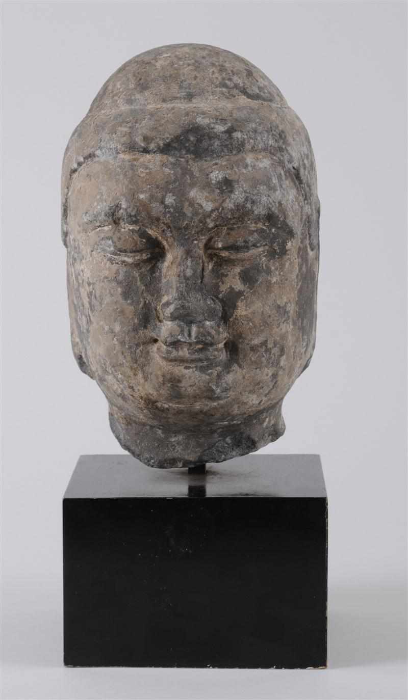 Appraisal: LIMESTONE HEAD OF A BODHISATTVA TH CENTURY The soft rounded