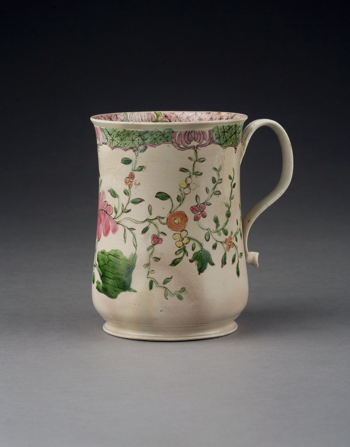 Appraisal: STAFFORDSHIRE SALTGLAZE ENAMELED MUG CIRCA - Of baluster form with