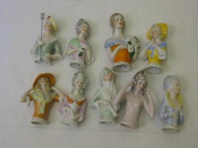 Appraisal: Nine porcelain pin cushion dolls including one nude two holding