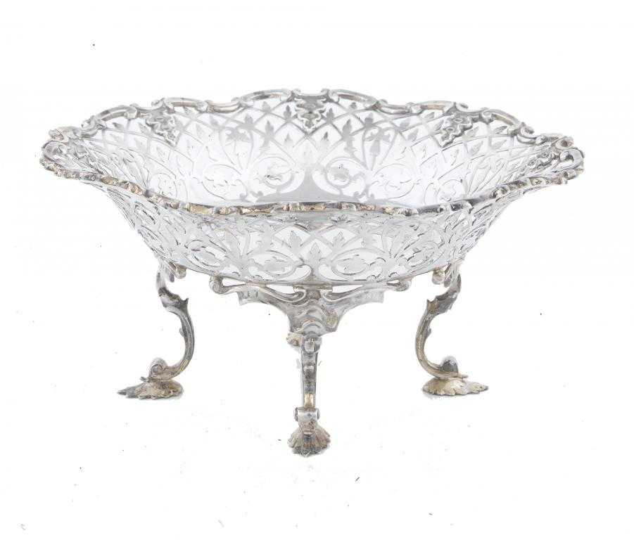 Appraisal: A GEORGE V SAW PIERCED SWEETMEAT DISH on four scrolling