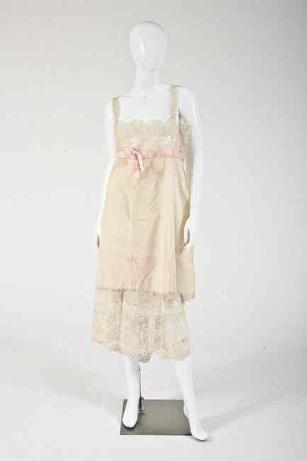 Appraisal: VINTAGE BEADED AND EMBROIDERED CREAM CREPE DAY DRESS s- s