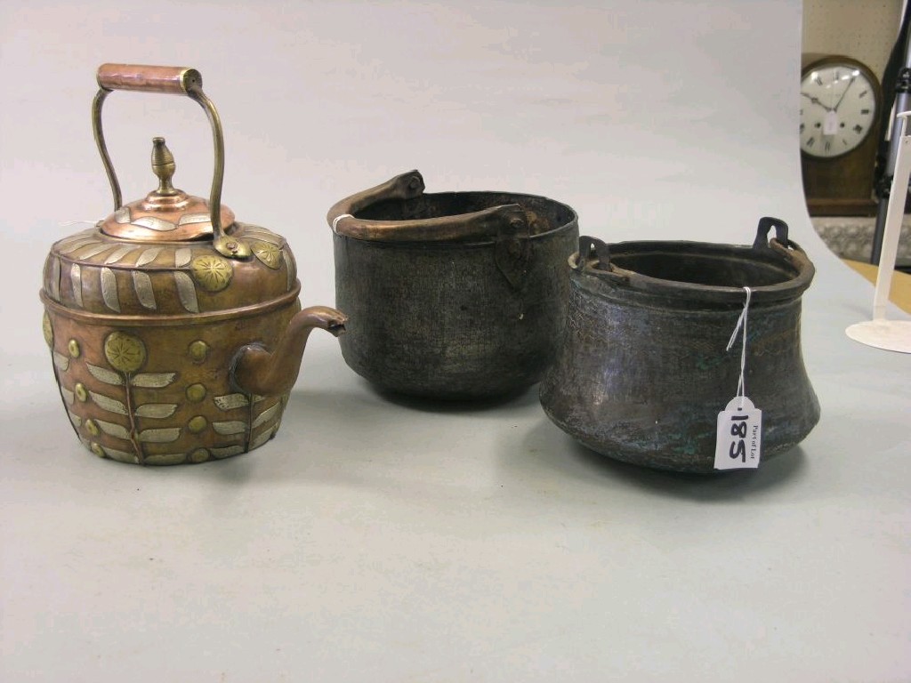 Appraisal: A copper kettle mounted with brass and nickel leafage and